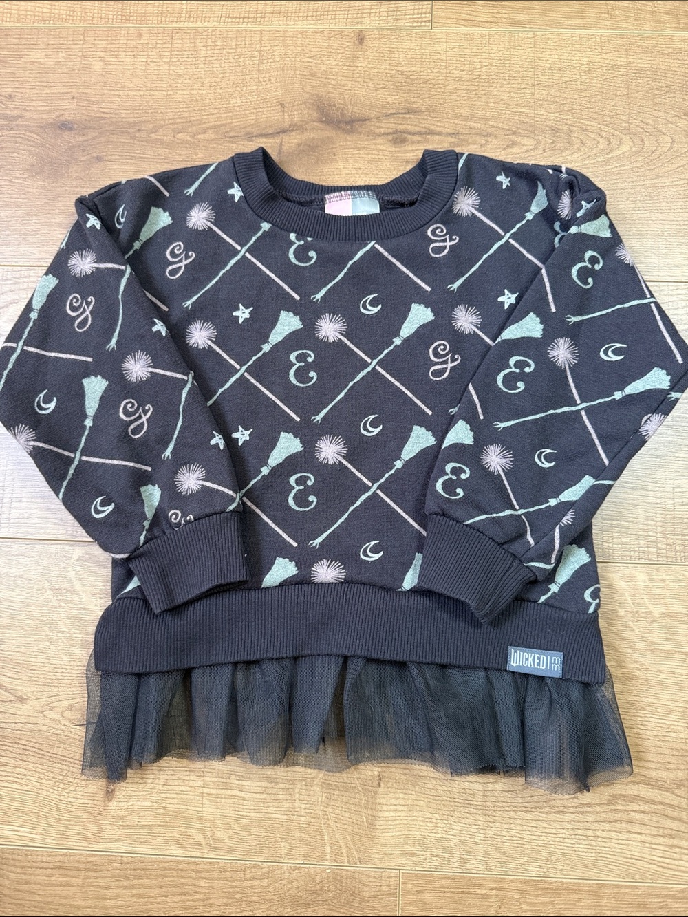Wicked Black & Mint E and G with broom and wand Print Ruffle Sweatshirt
